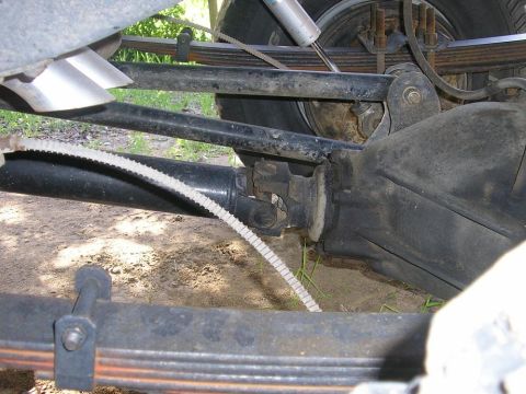 1979 Chevrolet C/K Pickup - Undercarriage view shows the rear axle assembly, leaf springs, and driveshaft of a vehicle.