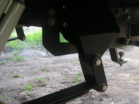 1979 Chevrolet C/K Pickup - Close-up view of the rear suspension and trailer hitch components on a vehicle.