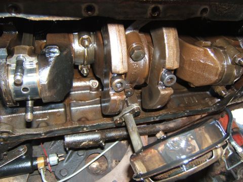 1946 Jeep CJ5 - Close-up view of the engine's crankshaft and connecting rods, showing internal components.
