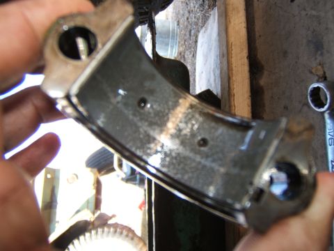1946 Jeep CJ5 - Close-up of a used engine bearing part, likely from a vehicle's internal engine components.