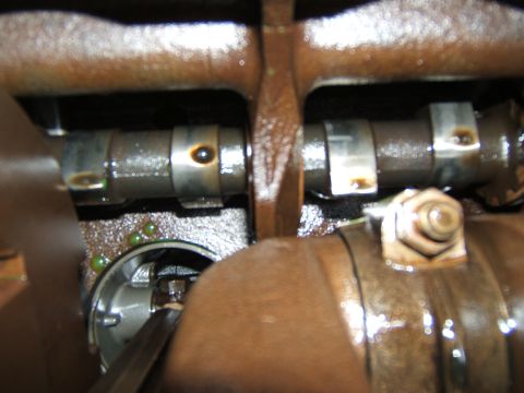 1946 Jeep CJ5 - Engine camshafts shown in detail, covered in oil.