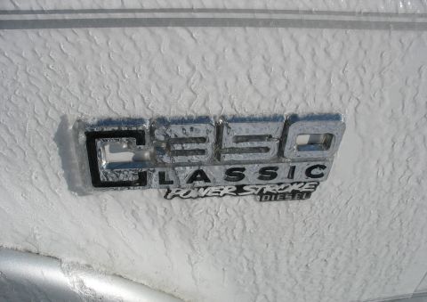 1995 Ford C-350 (Centurion Conversions) - The "C350 Classic Power Stroke Diesel" badge is visible on the side of a vehicle coated in ice.