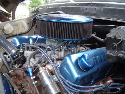 1978 Ford Bronco - Close-up of a Ford V8 engine, custom blue valve covers and an aftermarket air cleaner assembly.