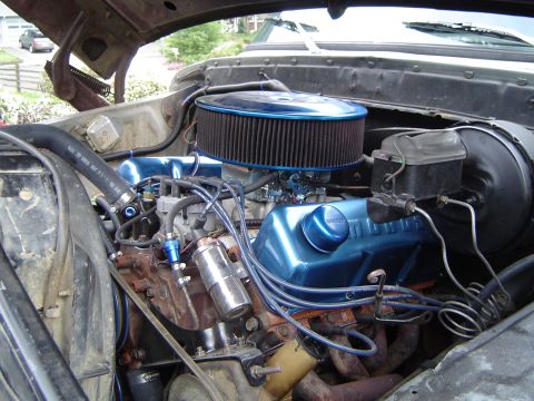 1978 Ford Bronco - The engine bay shows a V8 motor with blue painted valve covers and a large air filter assembly.