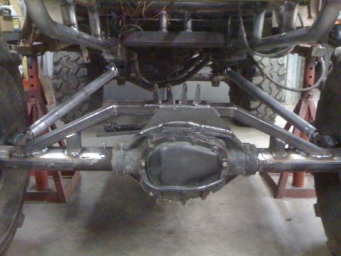 1966 Ford Bronco - Custom suspension components are welded onto the vehicle's frame and rear axle.