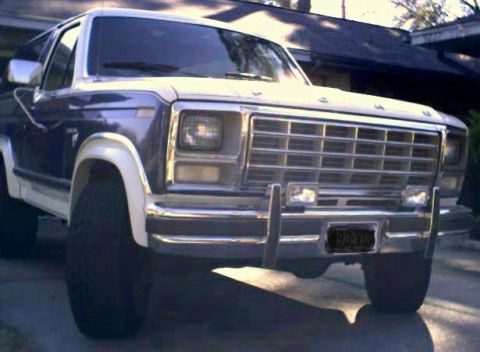 1981 Ford Bronco - This blue and white Ford Bronco from the 1980s is shown from a 3/4 front angle.