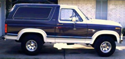 1981 Ford Bronco - Side view of a two-tone blue and white Ford Bronco.
