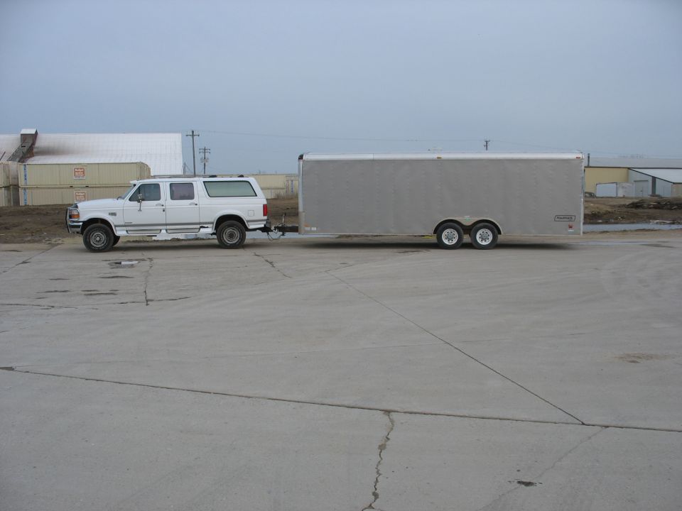 White Ford Bronco Centurion conversion with trailer