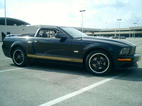 2007 Ford Mustang - A black 2007 Ford Mustang Shelby GT-H convertible is parked in an outdoor lot.
