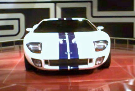 1981 Ford Bronco - This front view shows a white sports car with blue racing stripes.