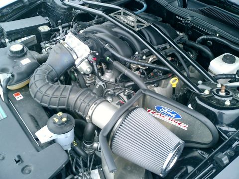 2006 Ford Mustang - Close-up of a Ford Racing engine bay, showing the air intake system and engine components.