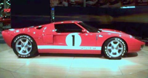 1981 Ford Bronco - A red race car with a white stripe and the number 1 on its side is displayed.