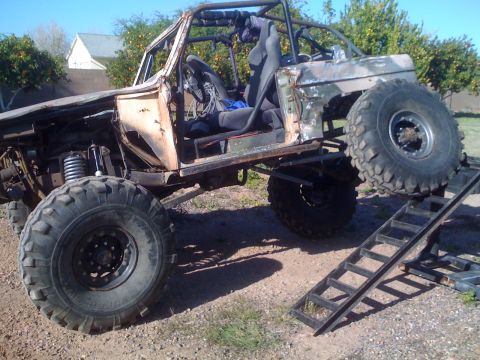 1966 Ford Bronco - This heavily modified off-road vehicle appears to be a custom build with significant alterations from its original form.