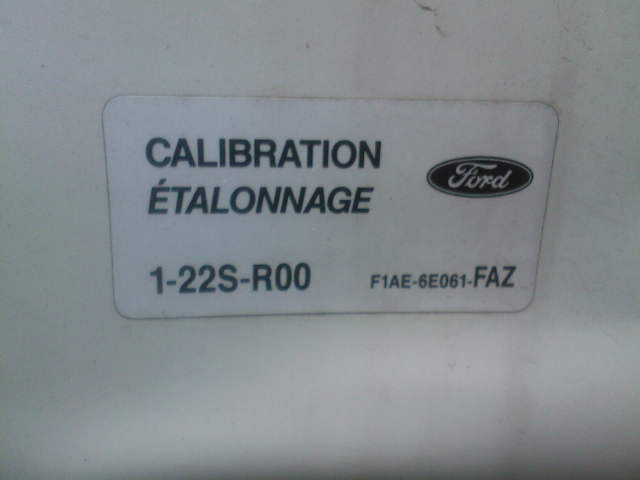 Ford calibration label reading 1-22S-R00 F1AE-6E061-FAZ