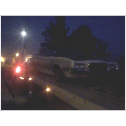 1972 Ford Ranchero - A 1972 Ford Ranchero is seen being towed at night, with another vehicle behind it.