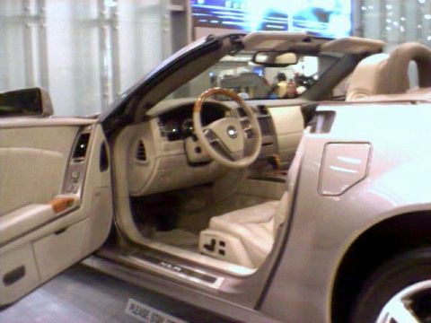 1981 Ford Bronco - Interior of a convertible showing tan leather seats and dashboard details.