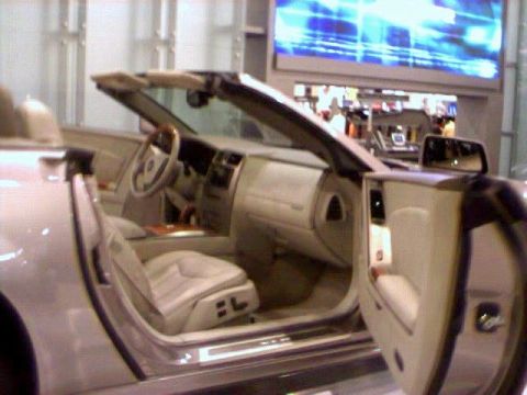 1981 Ford Bronco - The interior of a convertible is shown with the driver's side door open, revealing the seats and dashboard.