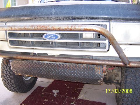 1991 Ford Bronco - Custom fabricated front bumper diamond plate and a bull bar, attached to a Ford truck.