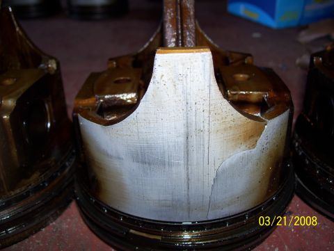 1978 Ford Bronco - Engine pistons show significant damage, including cracks and scoring, indicating internal engine failure.
