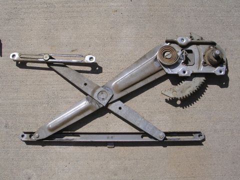 1983 Ferrari Enzo - This is a mechanical window regulator assembly, likely from a car door.