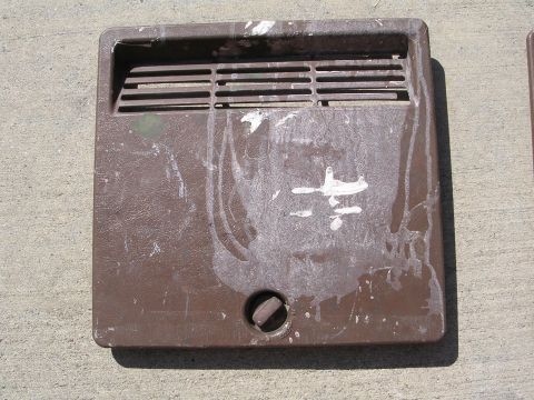 1983 Ferrari Enzo - This brown vent cover shows signs of wear and white paint splatters, with a central knob for adjustment.