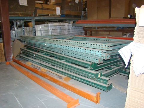 1989 Ford Bronco - Industrial shelving units are organized and stored within a warehouse environment.