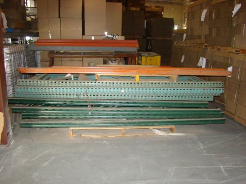 1989 Ford Bronco - Shelving units and boxes are stored in a warehouse environment.