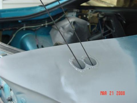 1993 Ford Probe - Close-up of a car's interior and hood panel, showing primer and wiring details.