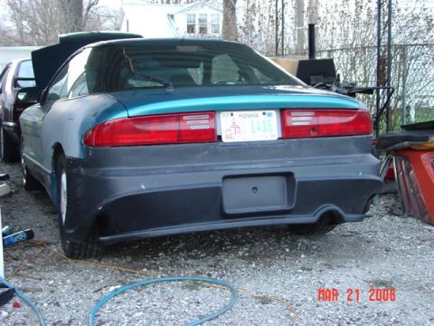 1993 Ford Probe - Rear view of a 1993 Ford Probe with custom bumper modifications and an Indiana license plate.