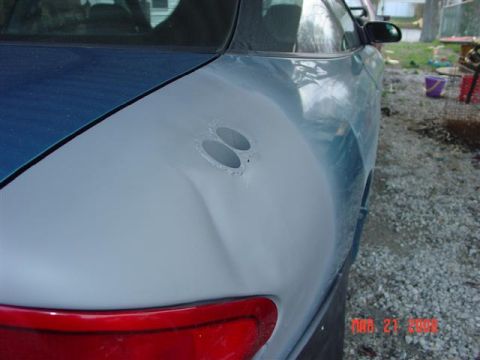 1993 Ford Probe - Car body panel shows damage and preparation for repair, with a date stamp in the corner.