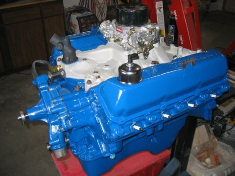 1979 Ford F-150 - A freshly painted Ford V8 engine sits on a stand, ready for installation.
