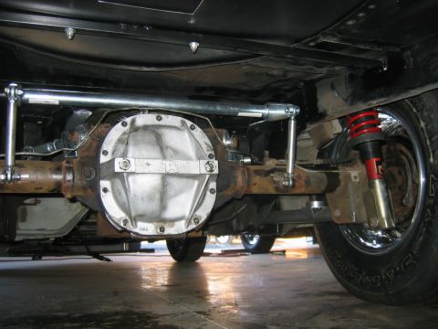 1992 Ford Mustang - Close-up of the rear axle assembly, showing aftermarket suspension modifications.