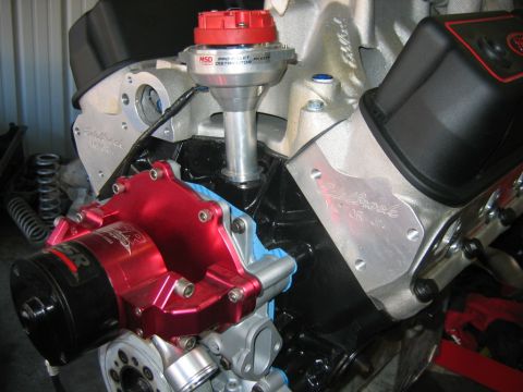 1992 Ford Mustang - Close-up of an engine a red Edelbrock water pump and an MSD Pro Billet distributor.