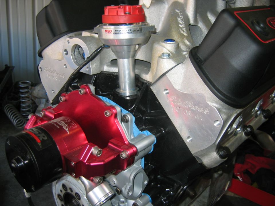 Engine with red Edelbrock water pump and MSD Pro Billet distributor