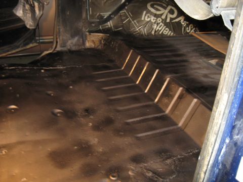 1978 Ford Bronco - Sound deadening material applied to the floor of a vehicle interior.