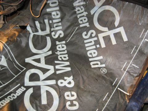 1978 Ford Bronco - A close-up of a roll of Grace Water Shield waterproofing material with visible text.