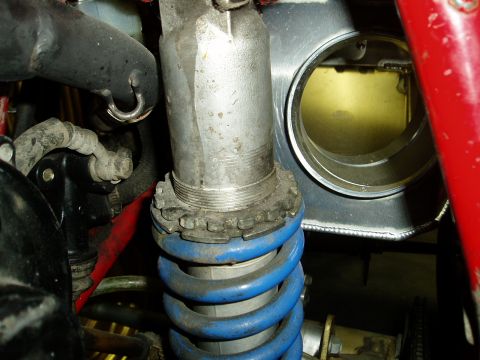 2000 Ford E350 - Close-up of a shock absorber and intake tube, likely from a performance vehicle or motorcycle.