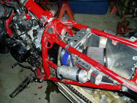 2000 Ford E350 - Close-up view of a motorcycle's internal components, including the engine and air intake system.
