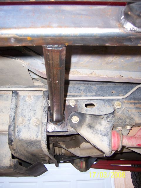 1991 Ford Bronco - Close-up view of custom fabricated sliders welded to the frame of an off-road vehicle.