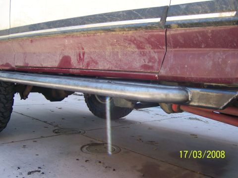 1991 Ford Bronco - Custom rock sliders are installed on this 1991 Ford Bronco, showing off its off-road modifications.