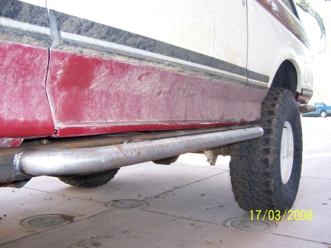 1991 Ford Bronco - Custom rock sliders installed on the side of a 1991 Ford Bronco.
