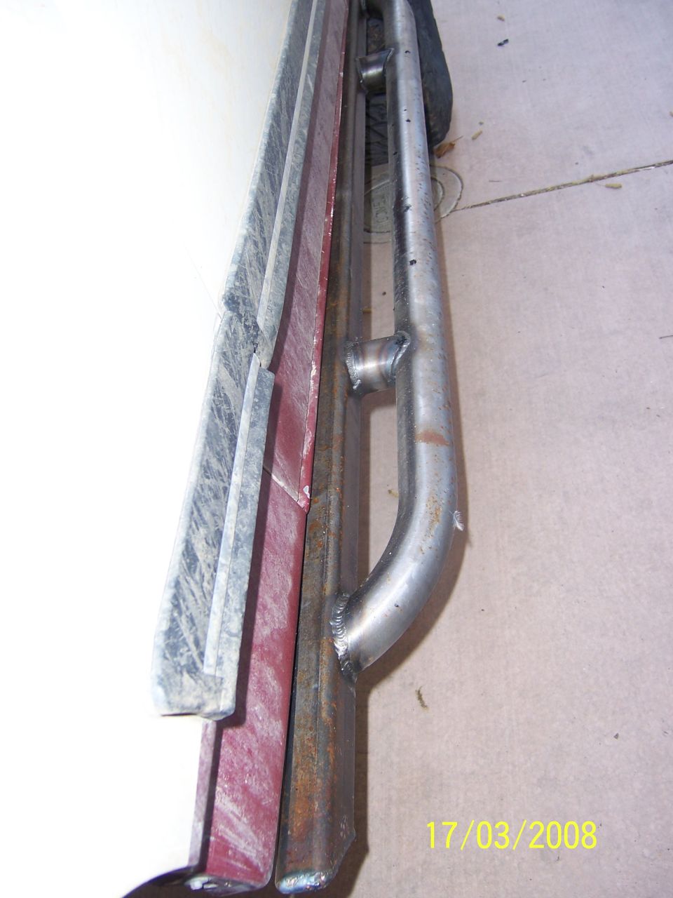 fabricated steel sliders with a curved section and mounting points