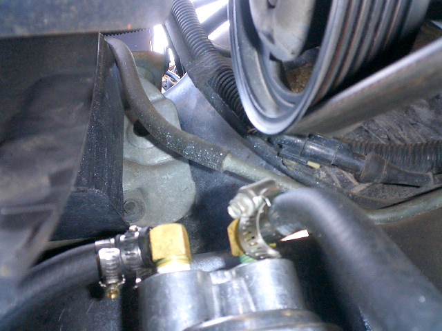 Top of filter and proximity to serpentine belt.