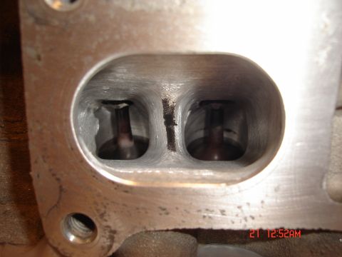 1993 Ford Probe - Engine cylinder head intake ports with valves visible inside.