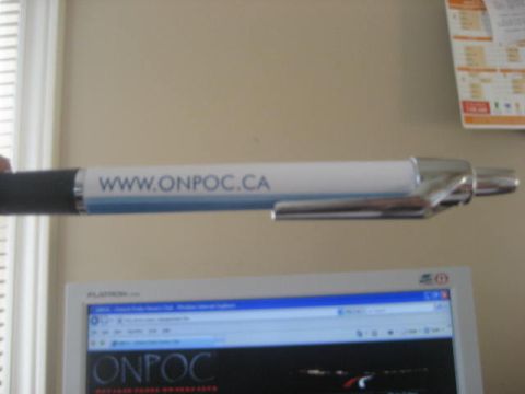 1993 Ford Probe - A pen with the website address www.onpoc.ca is held up in front of a computer monitor displaying the ONPOC logo.