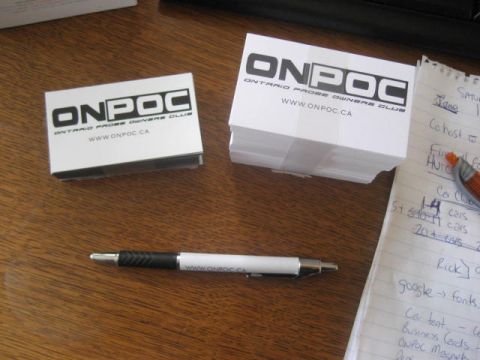 1993 Ford Probe - Business cards for the Ontario Probe Owners Club (ONPOC) and a pen are laid out on a desk.