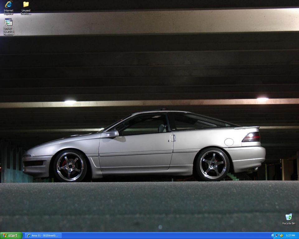 Windows XP desktop screenshot of a silver lowered Ford Probe wallpaper
