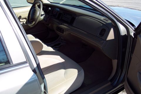 2001 Ford Crown Victoria - The interior of a 2001 Ford Crown Victoria is visible from the passenger side door.