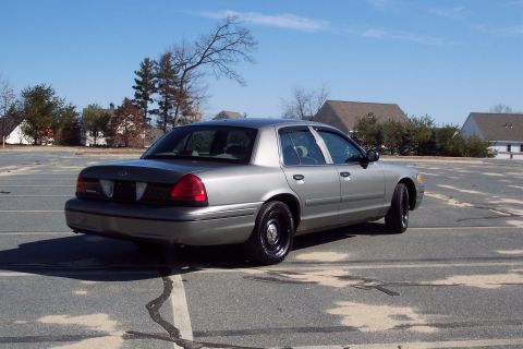 2001 Ford Crown Victoria - This 2001 Ford Crown Victoria is shown from the rear three-quarter angle.