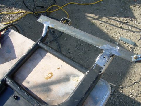 1991 Ford Bronco - A close-up view of a metal frame section undergoing repair, with a visible watermark.